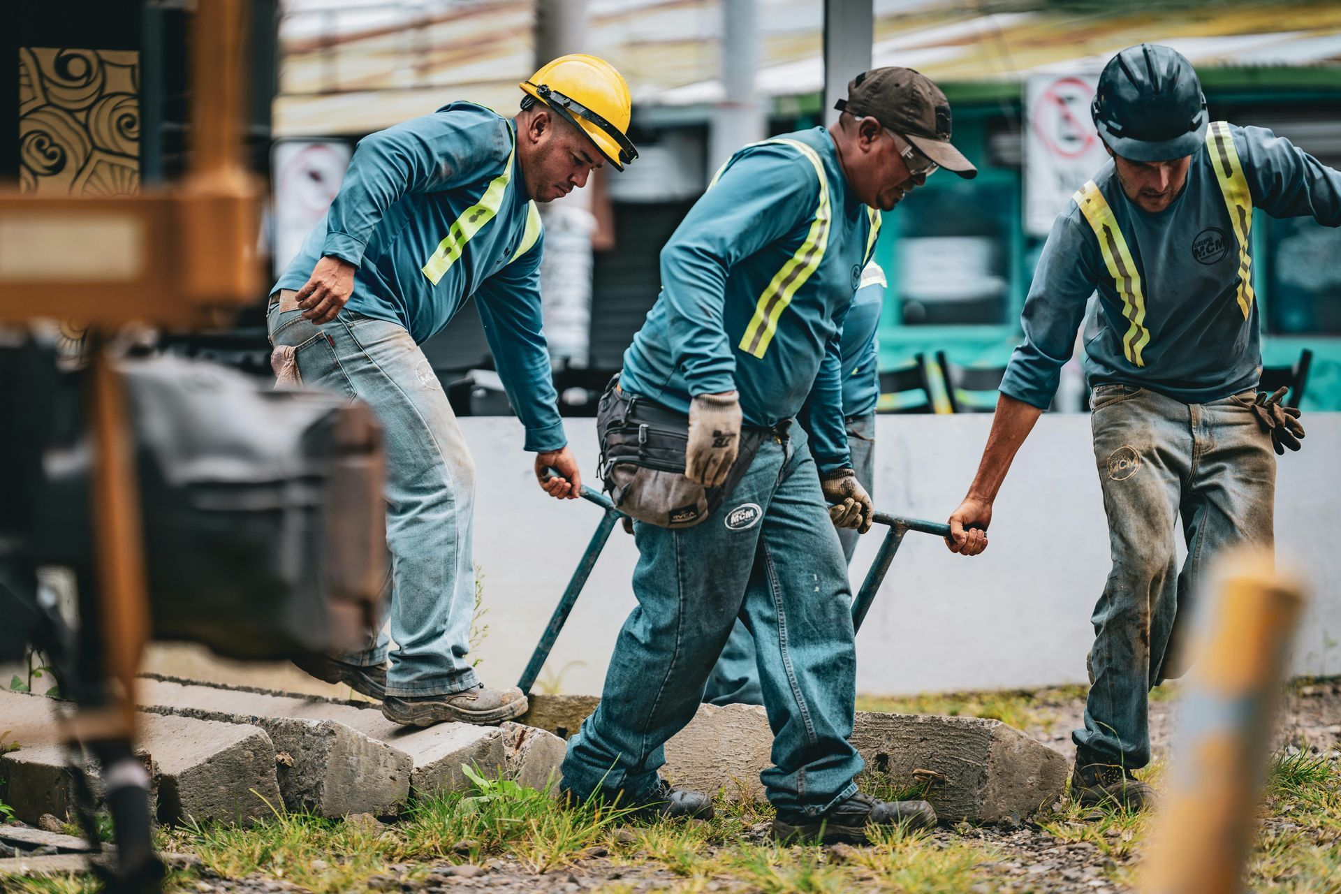 A group of construction workers are working on a construction site.