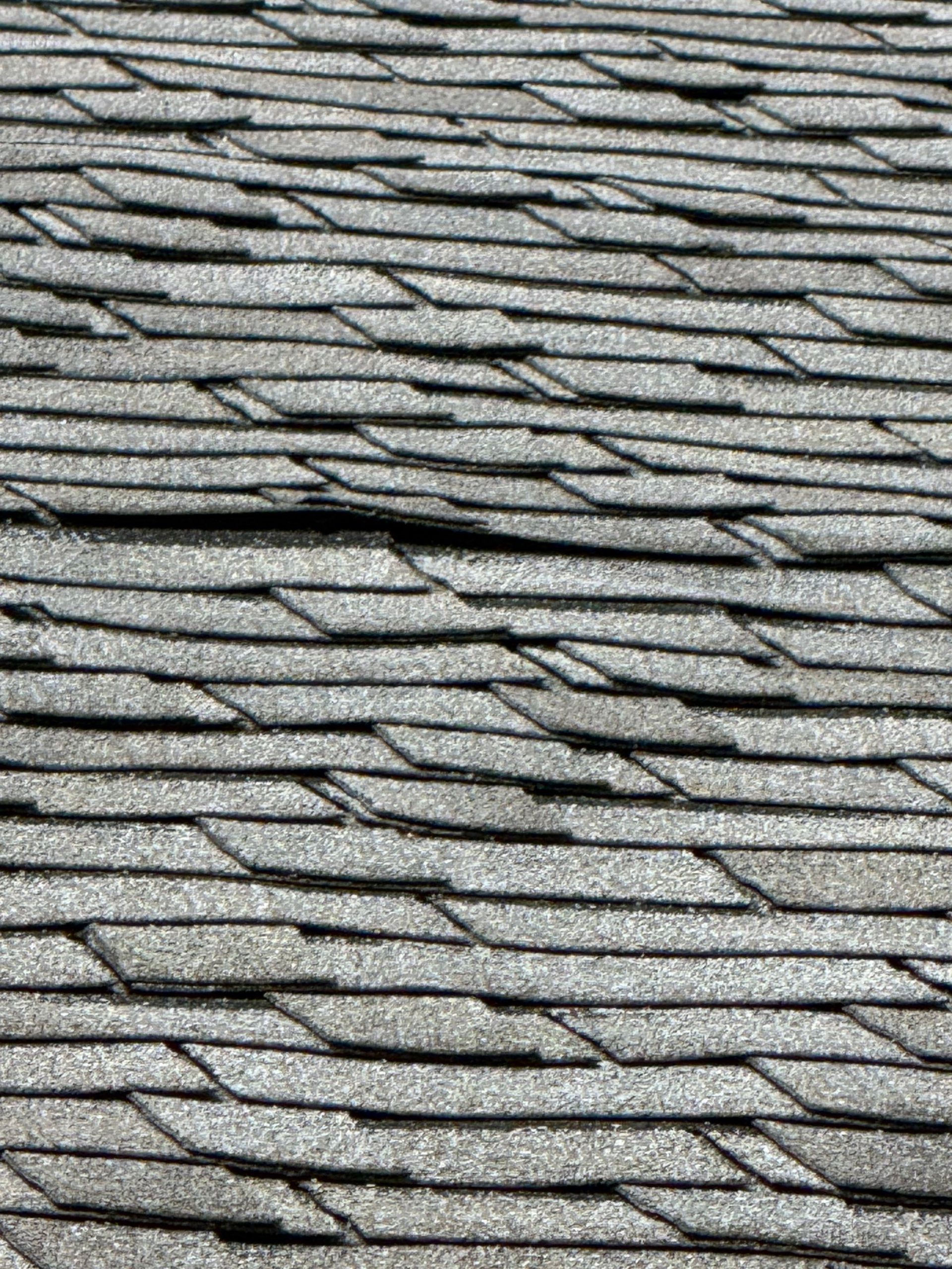 Curling shingles due to heat and UV exposure