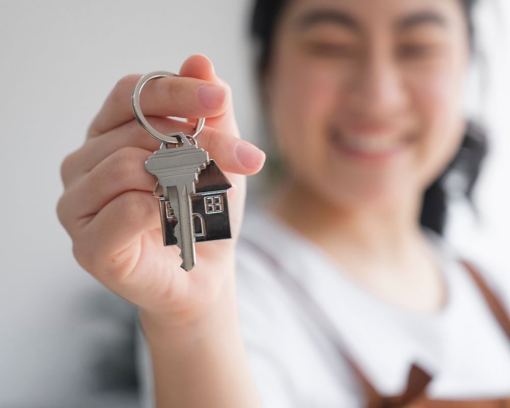 tenant holding up keys to camera