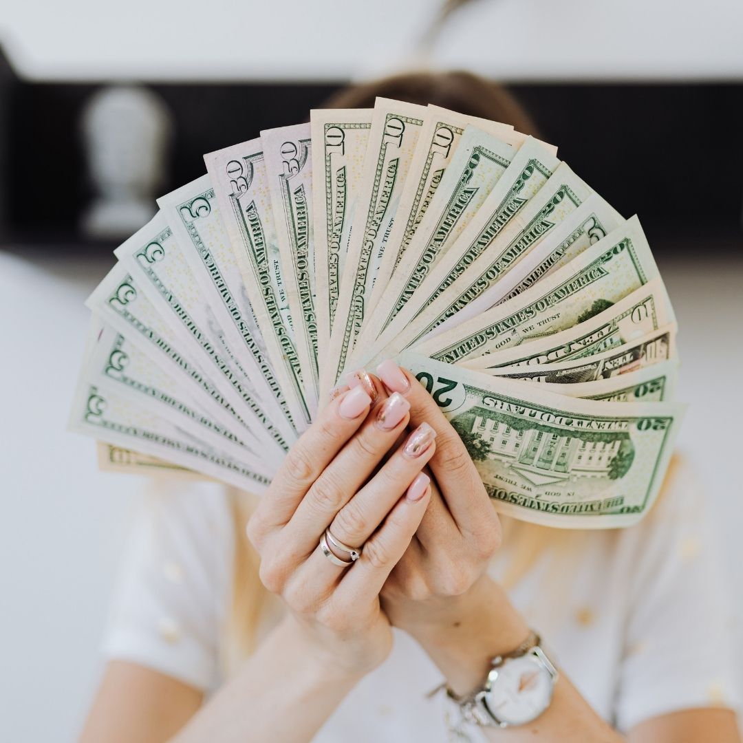 a person fanning money