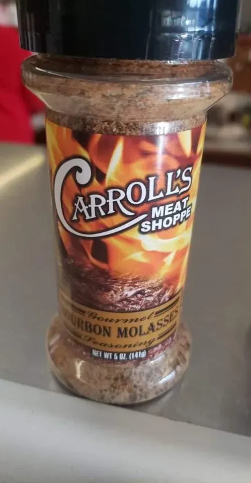 Jar of Arroz Meat Shop bourbon molasses seasoning on a countertop
