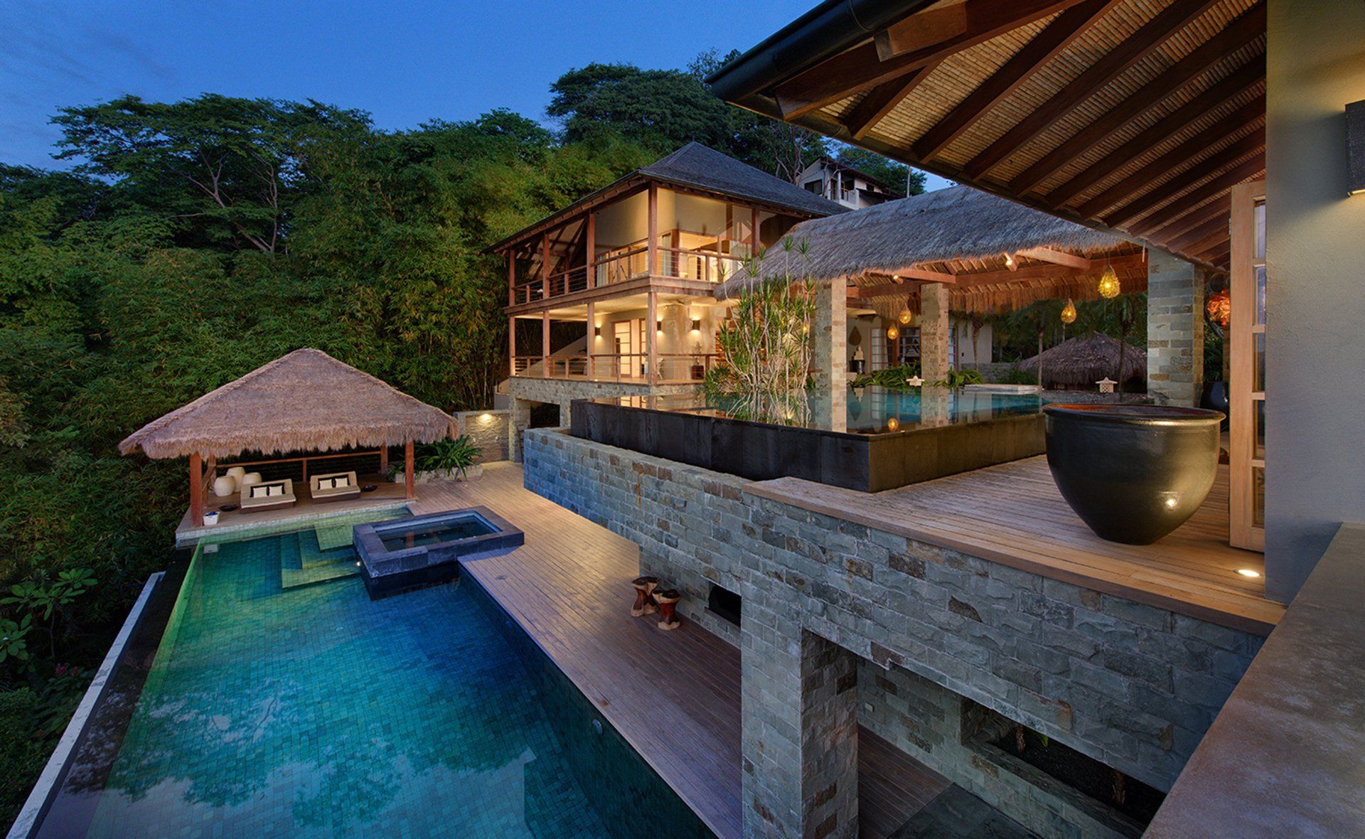 A large villa with a swimming pool in front of it, casa Alang Alan in Tamarindo