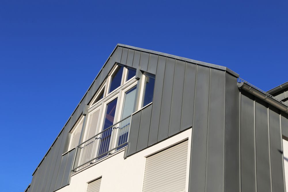 A House Is Being Built With A Ladder Attached To The Side Of It — Glenroofing Pty Ltd In Taree, NSW