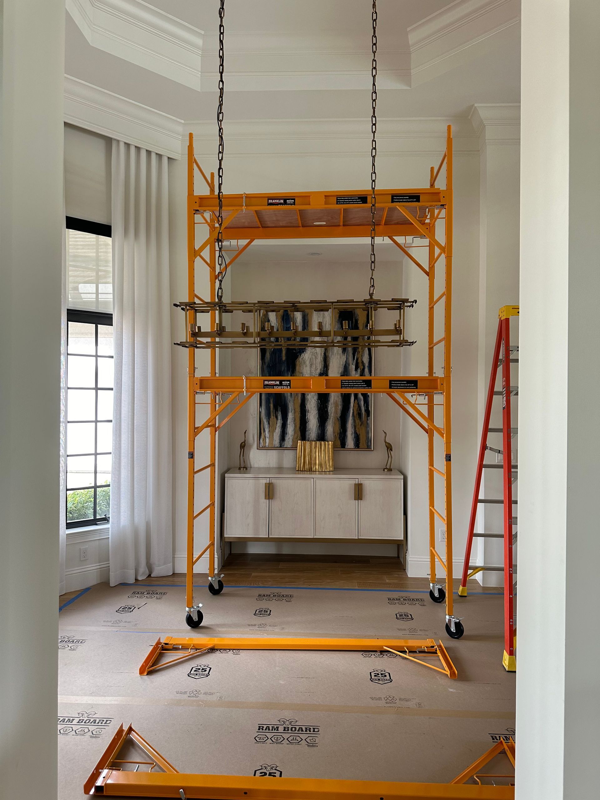 A room with scaffolding and a ladder in it