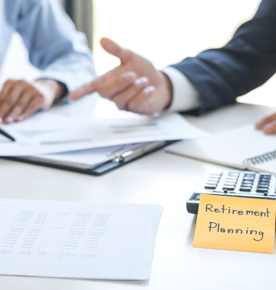 A yellow sticky note with retirement planning written on it