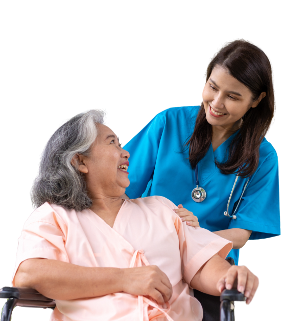 A nurse is talking to an elderly woman in a wheelchair.