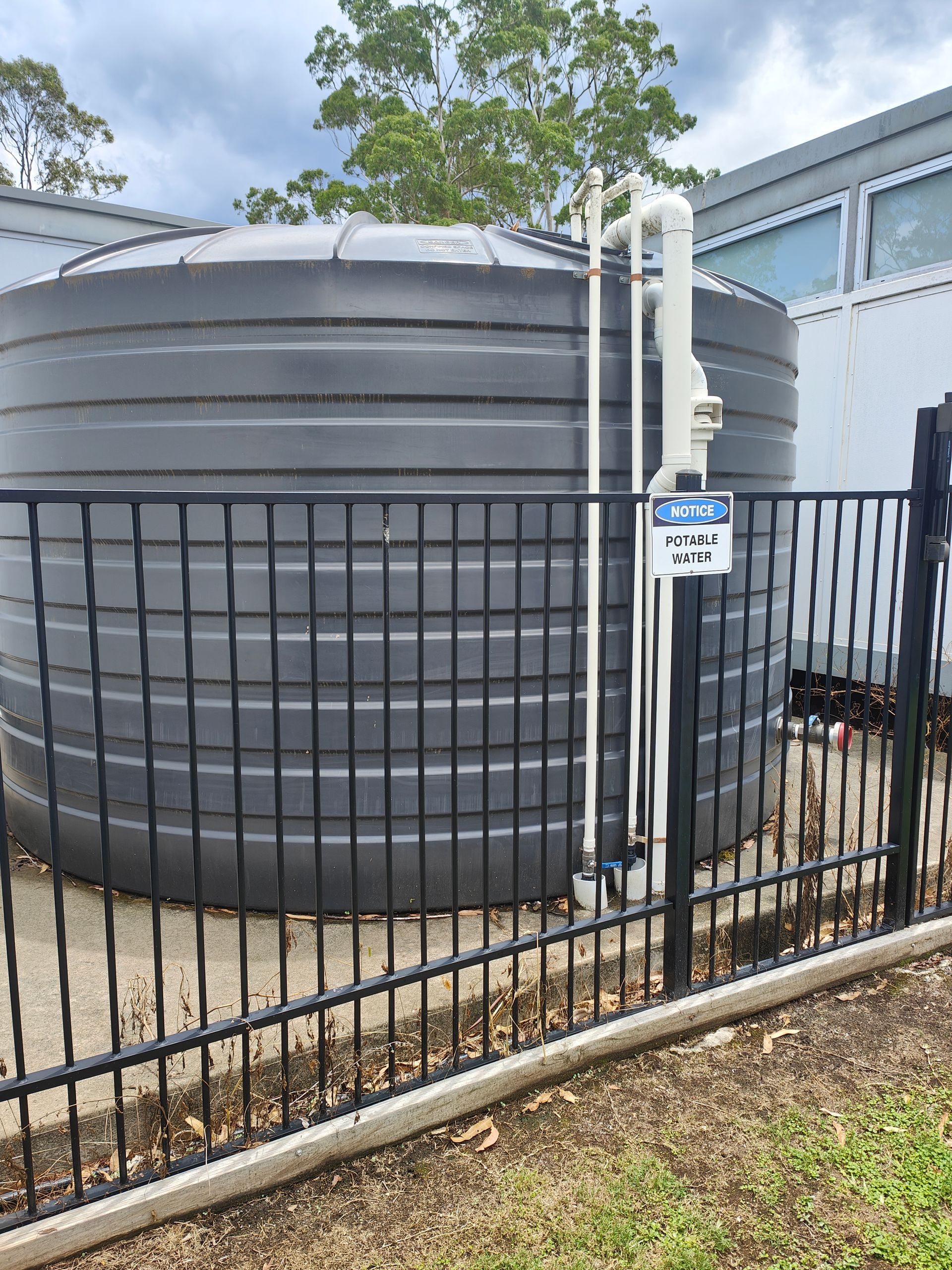 Water tank behind a fence - Hastings Water Care in Port Macquarie NSW