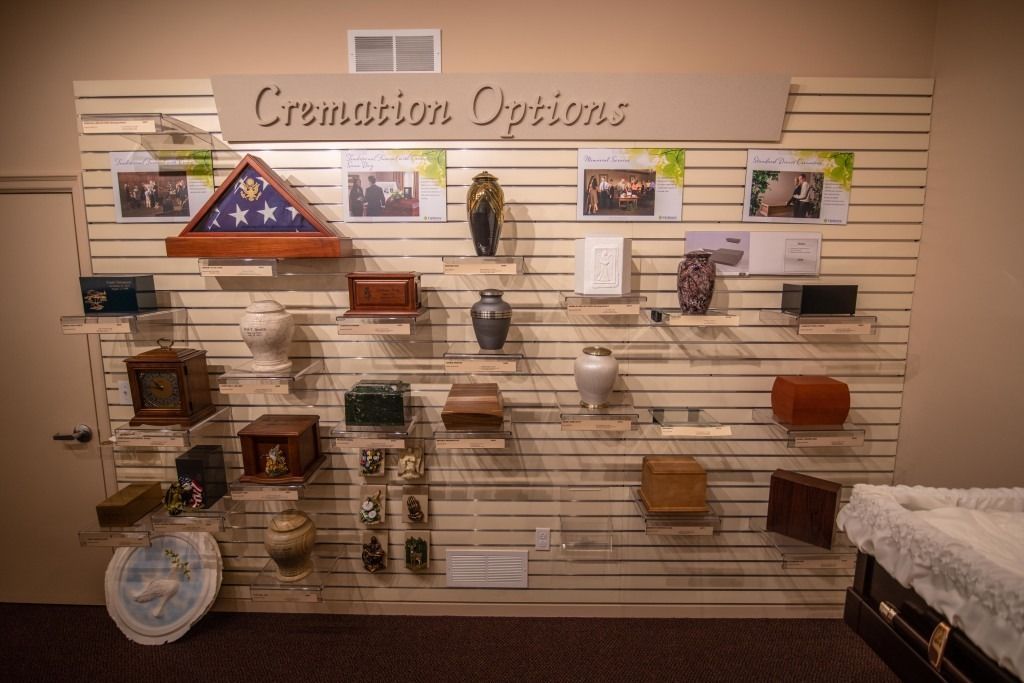 Display wall of ceramic ornaments and plaques in a gift shop or museum exhibit
