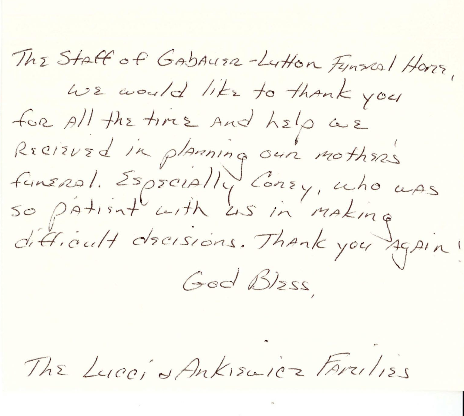 Handwritten thank-you note signed by the Lucas and Anibiah family on cream paper.