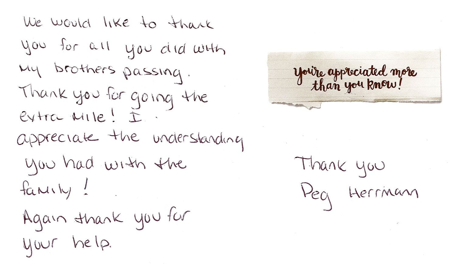 Handwritten thank-you note on white paper beside a small note and signature