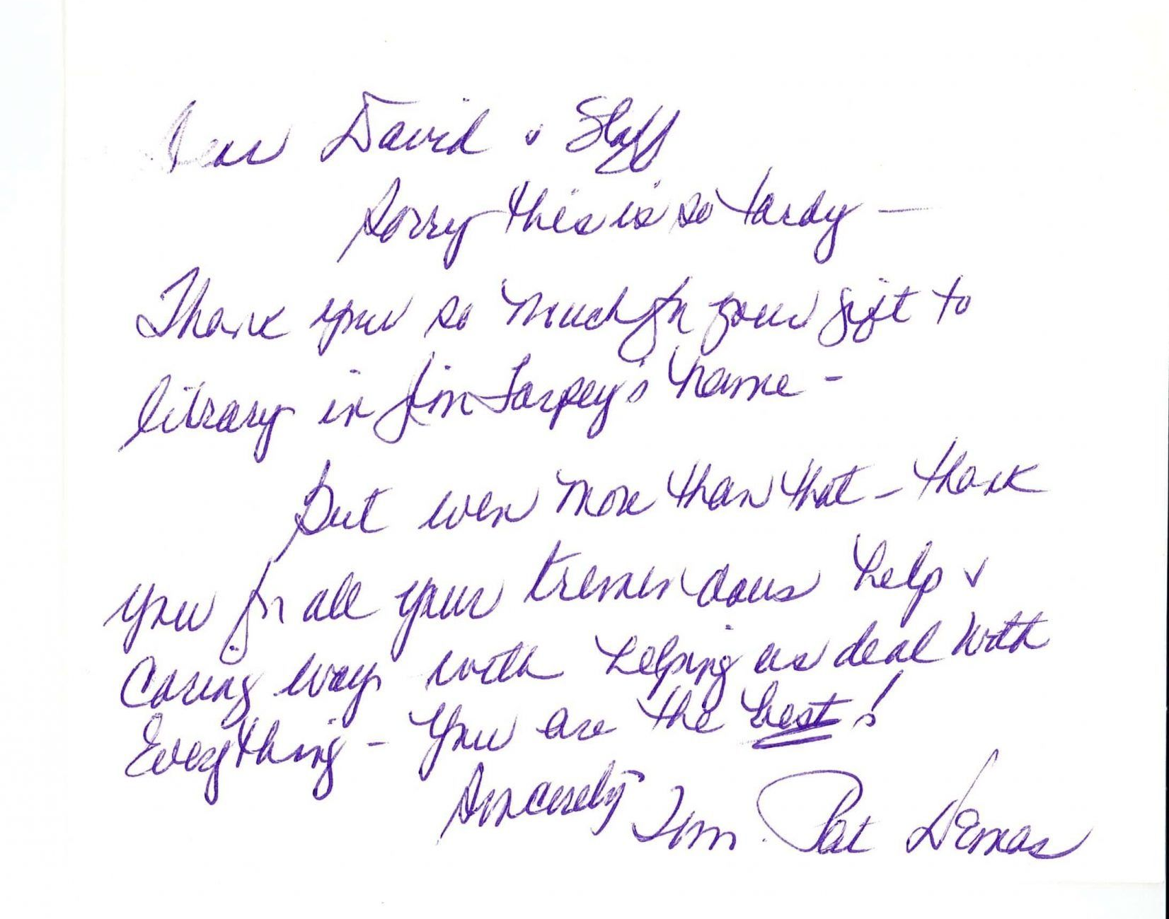 Handwritten cursive note in purple ink on white paper, slightly blurred.