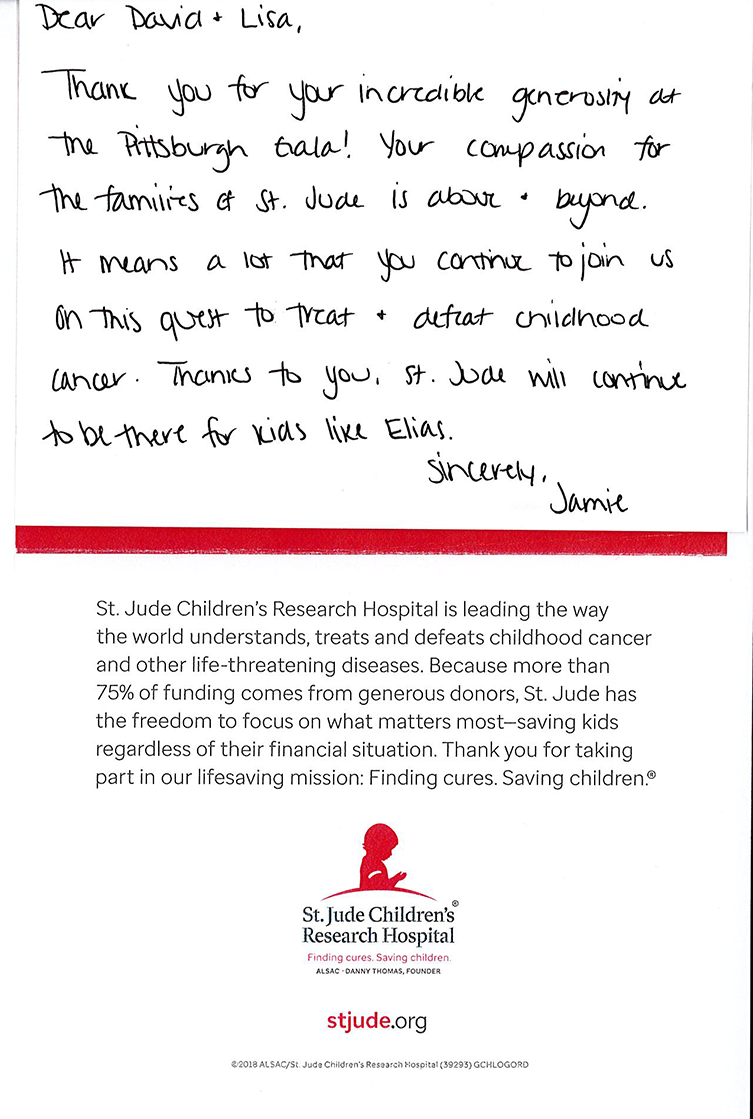 Handwritten note on white paper with a red horizontal line and small printed text/logo at the bottom.