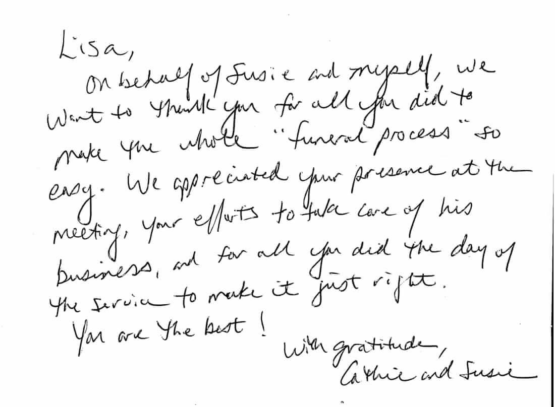 Handwritten note on white paper with black ink, signed at bottom right