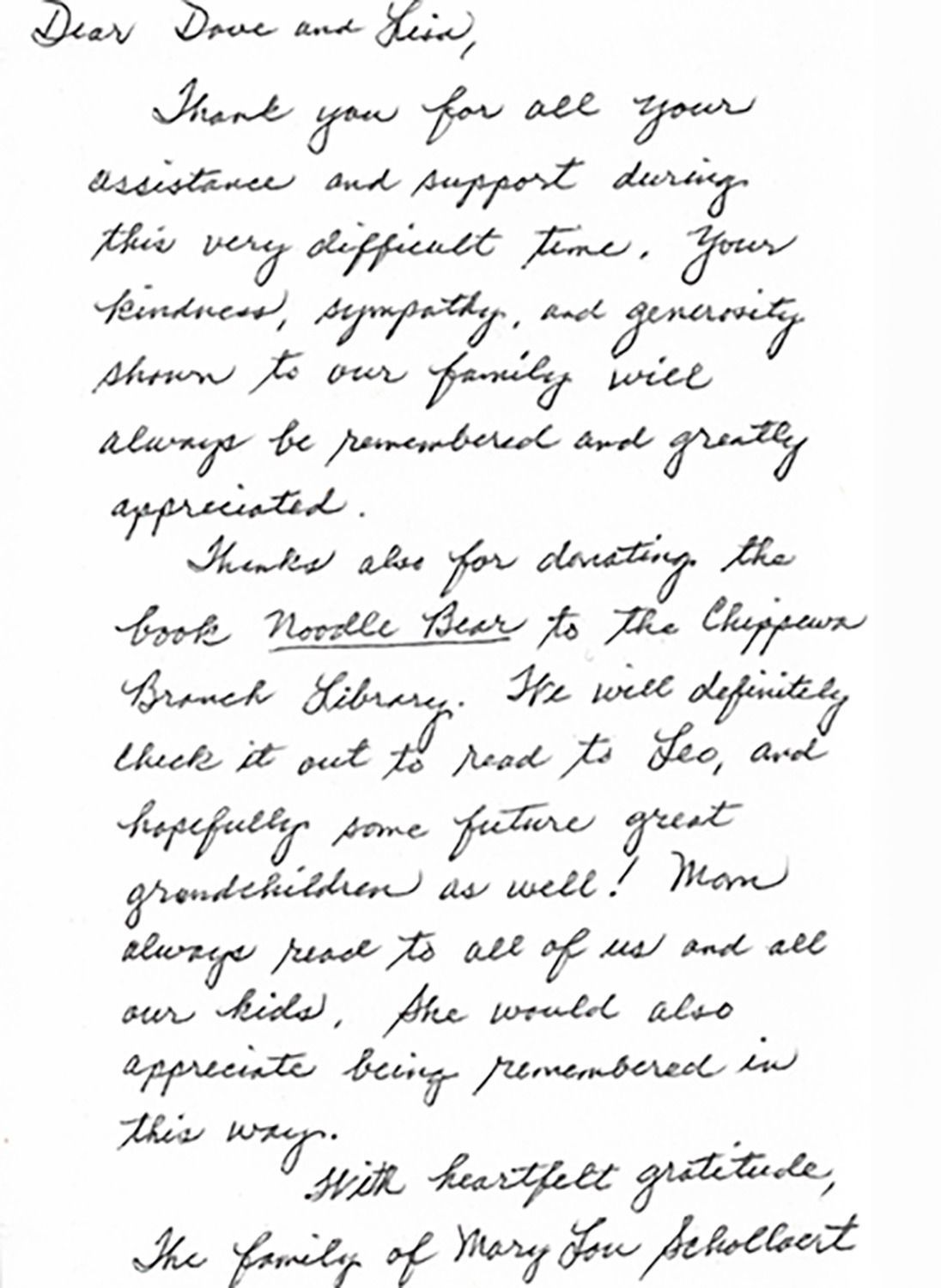 Handwritten thank-you letter in cursive on white paper, photographed close up.