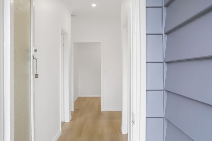 Home renovation by Nique Building Central Coast — open plan living with timber floors