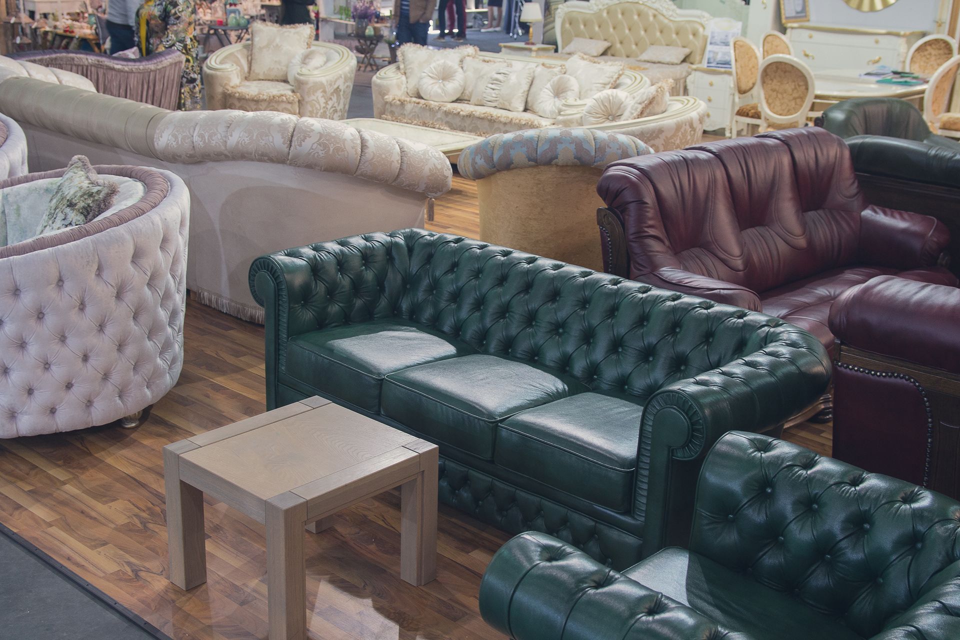 Furniture showroom with leather sofas and upholstered seating on display.