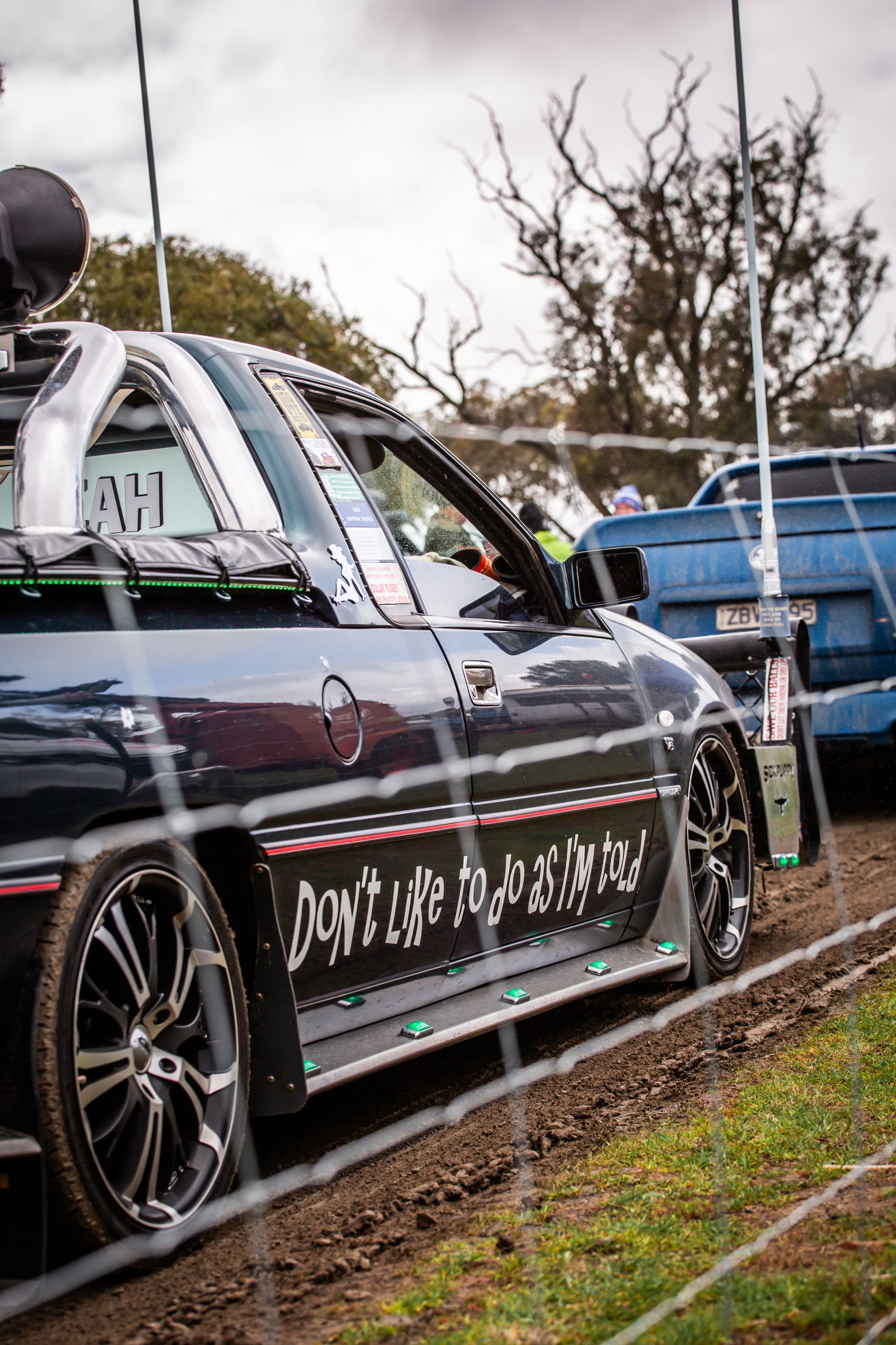 A black car with the word do n't care on the side