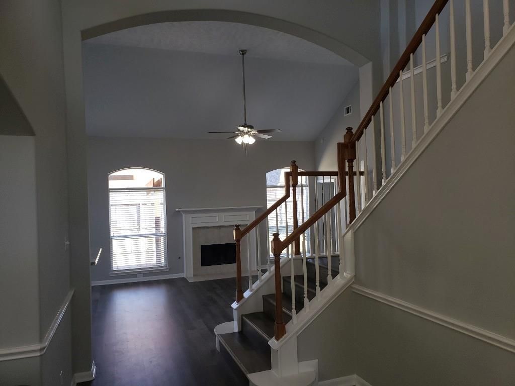 There is a staircase leading up to the second floor of a house.