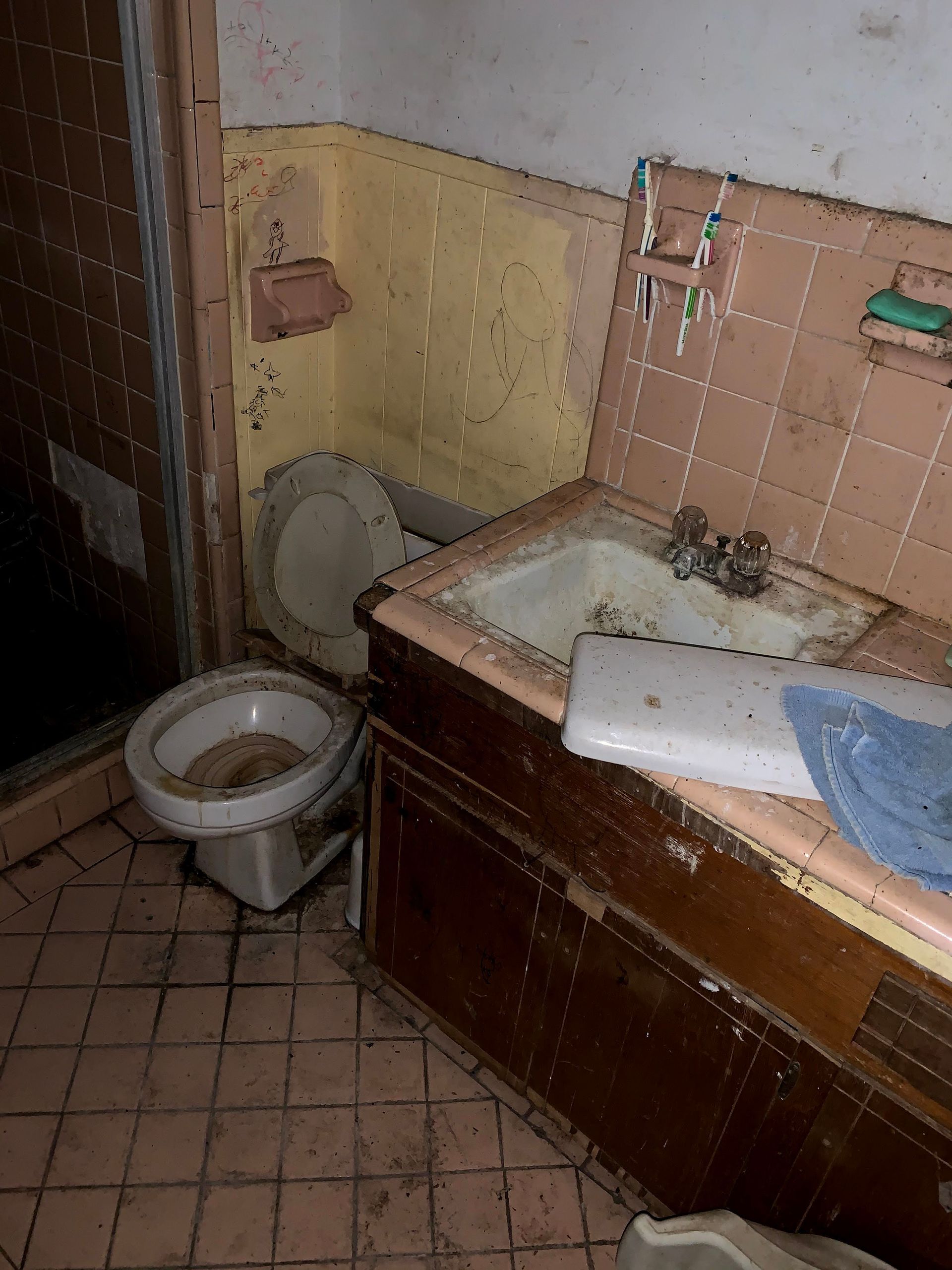 A bathroom with a toilet and sink in it