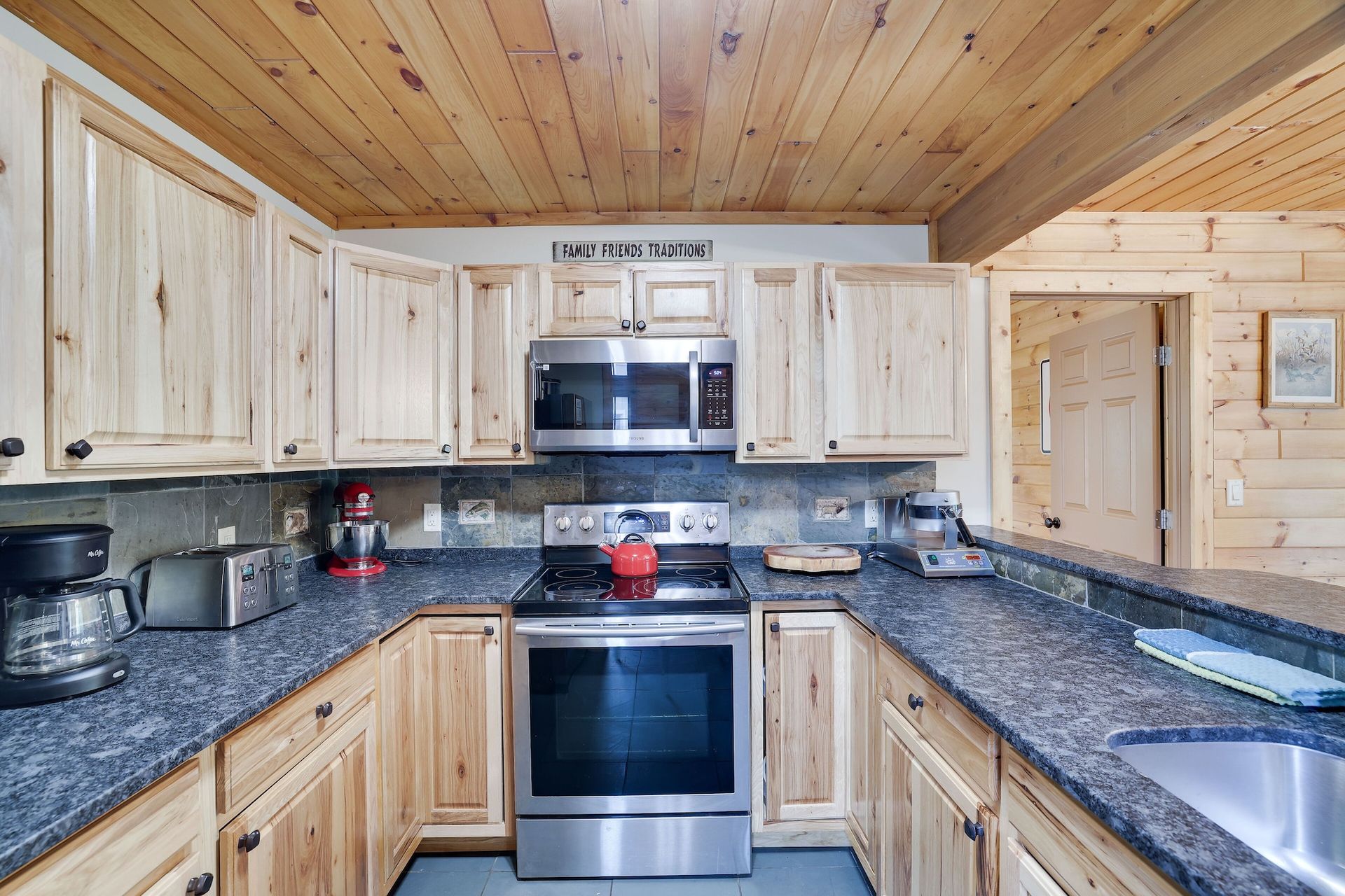 A kitchen with stainless steel appliances and granite counter tops