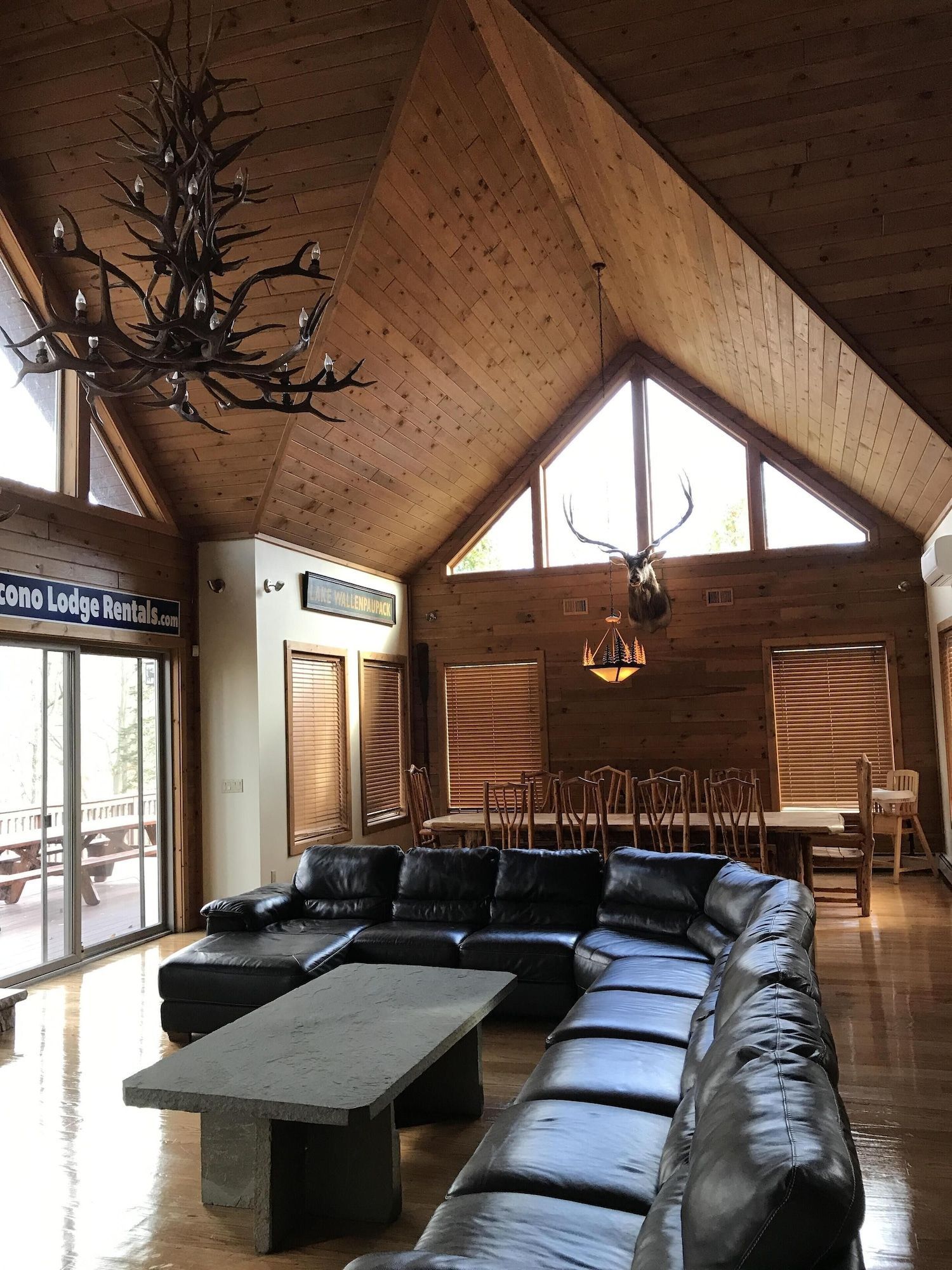 A living room with a large sectional couch and a coffee table