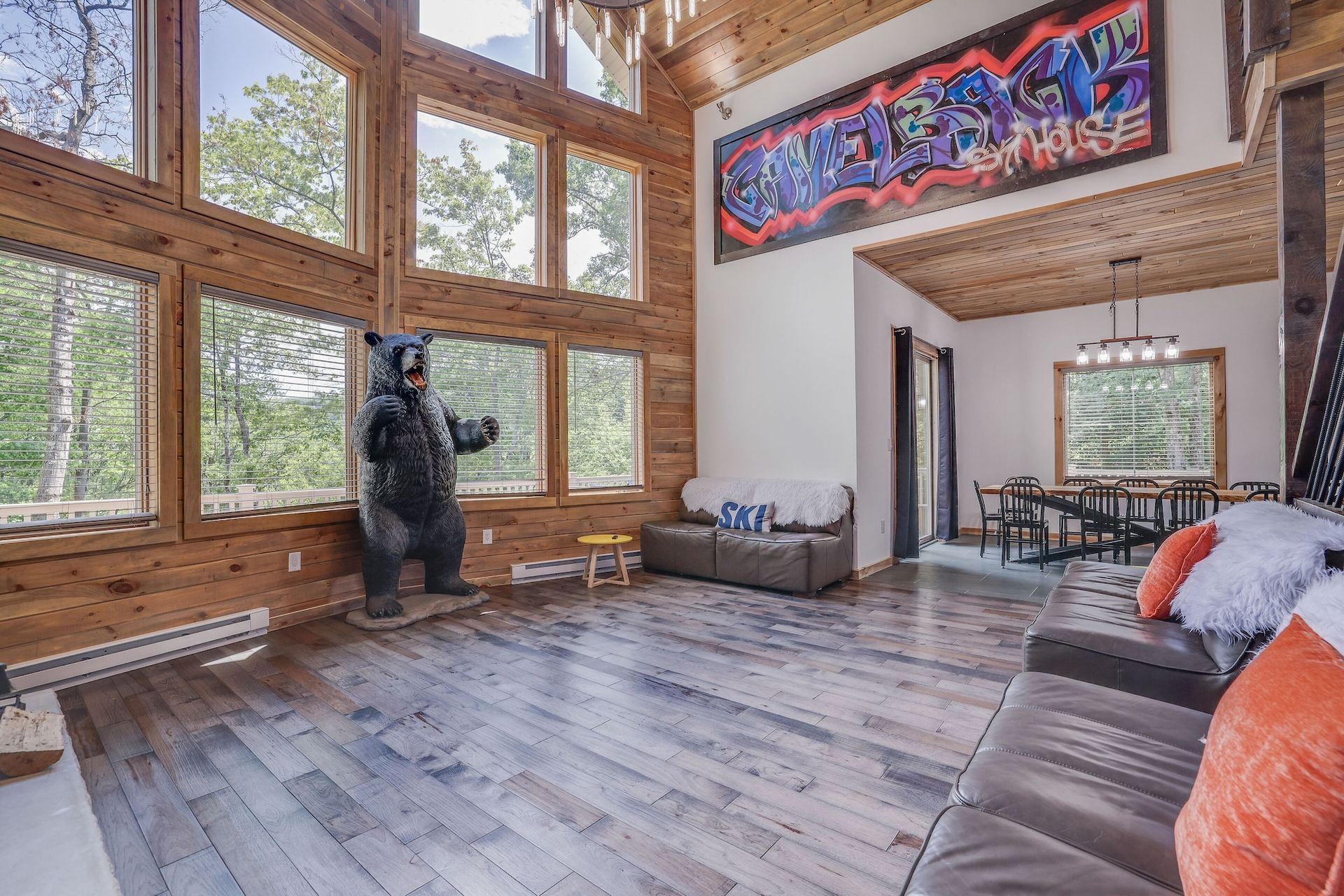 There is a statue of a bear in the middle of the living room.