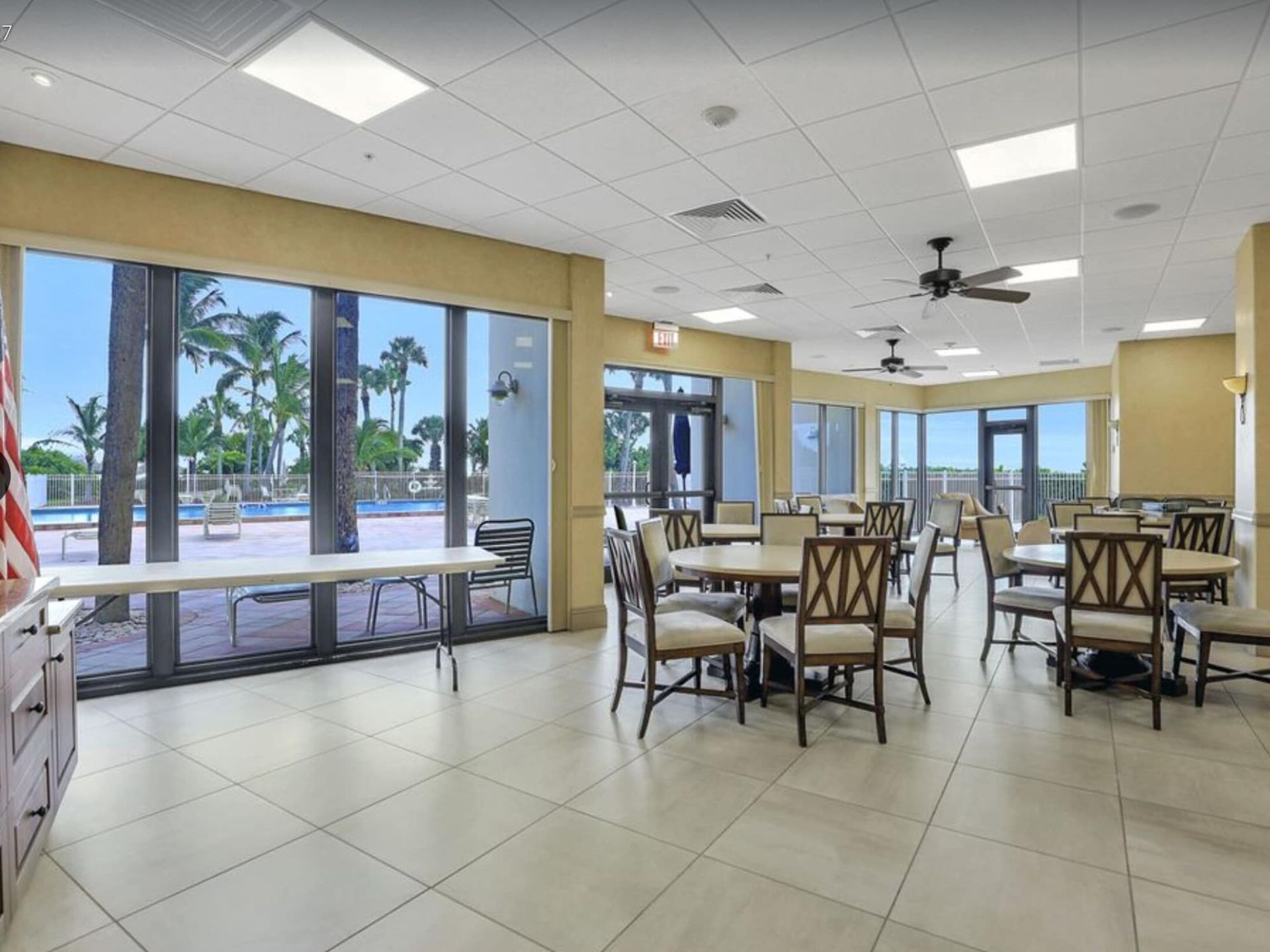 A large room with tables and chairs in it