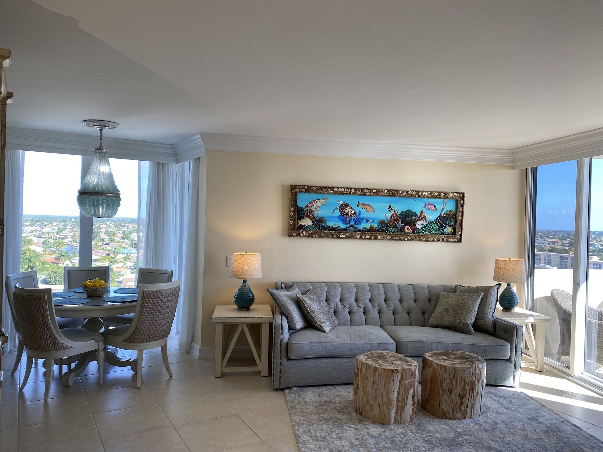 A living room with a couch and a painting on the wall