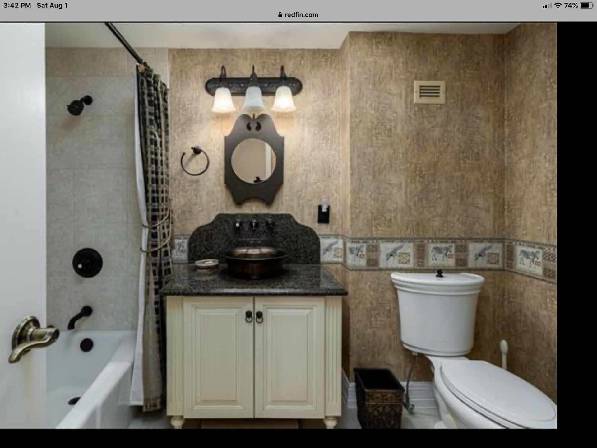 A bathroom with a sink toilet and bathtub