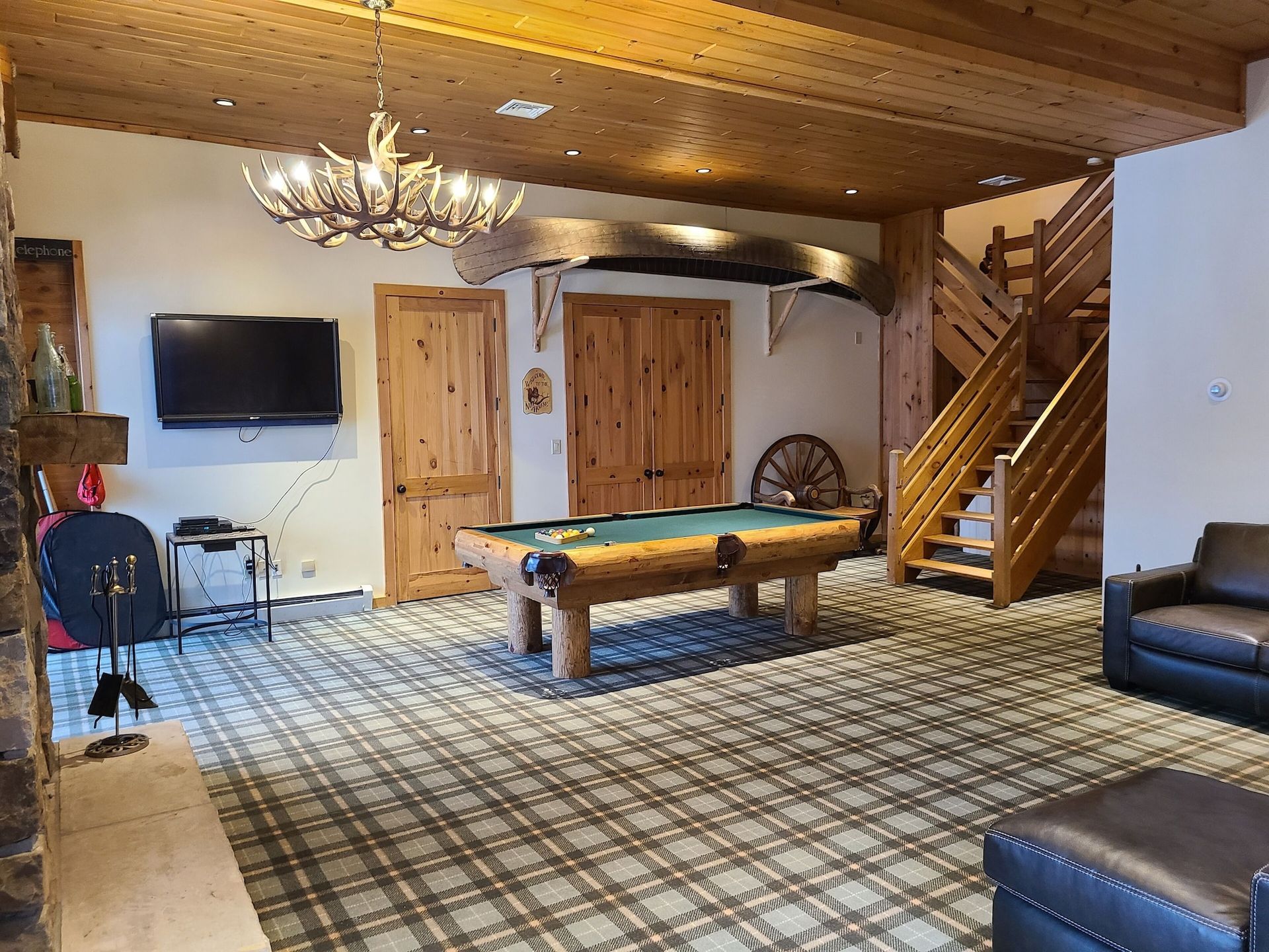 There is a pool table in the middle of the room.