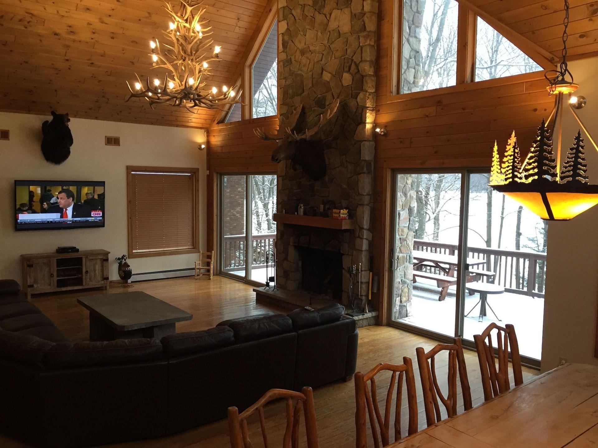A living room with a fireplace and a flat screen tv