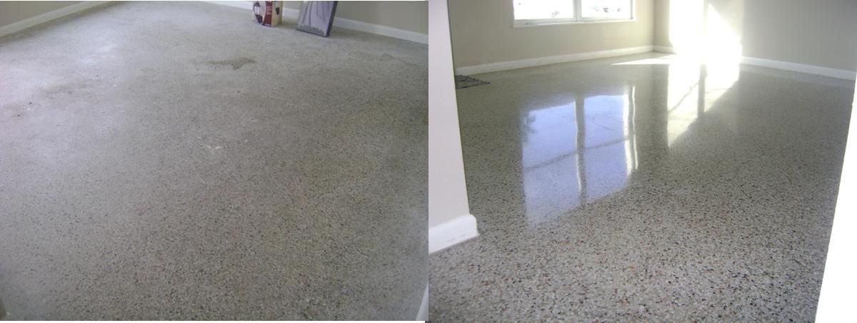 Empty carpeted room with a speckled floor and sunlight reflecting near a window.