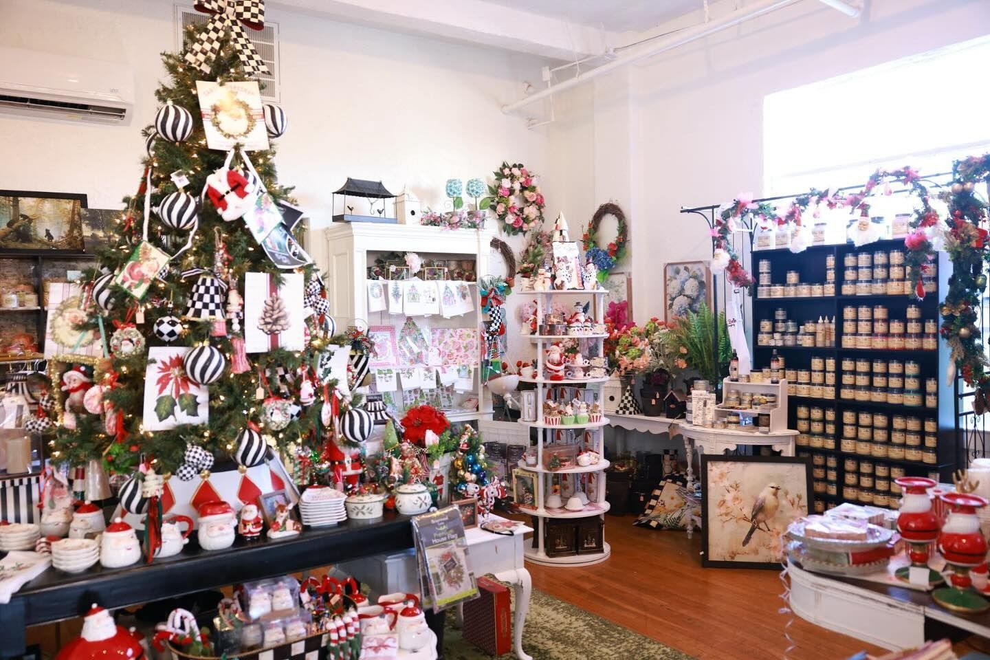 Festive holiday shop filled with Christmas decor, ornaments, and decorated trees