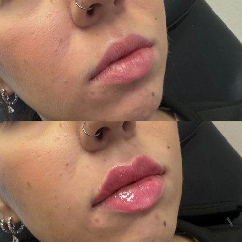 Close-up of a face with silver nose rings and glossy pink lips in a car seat