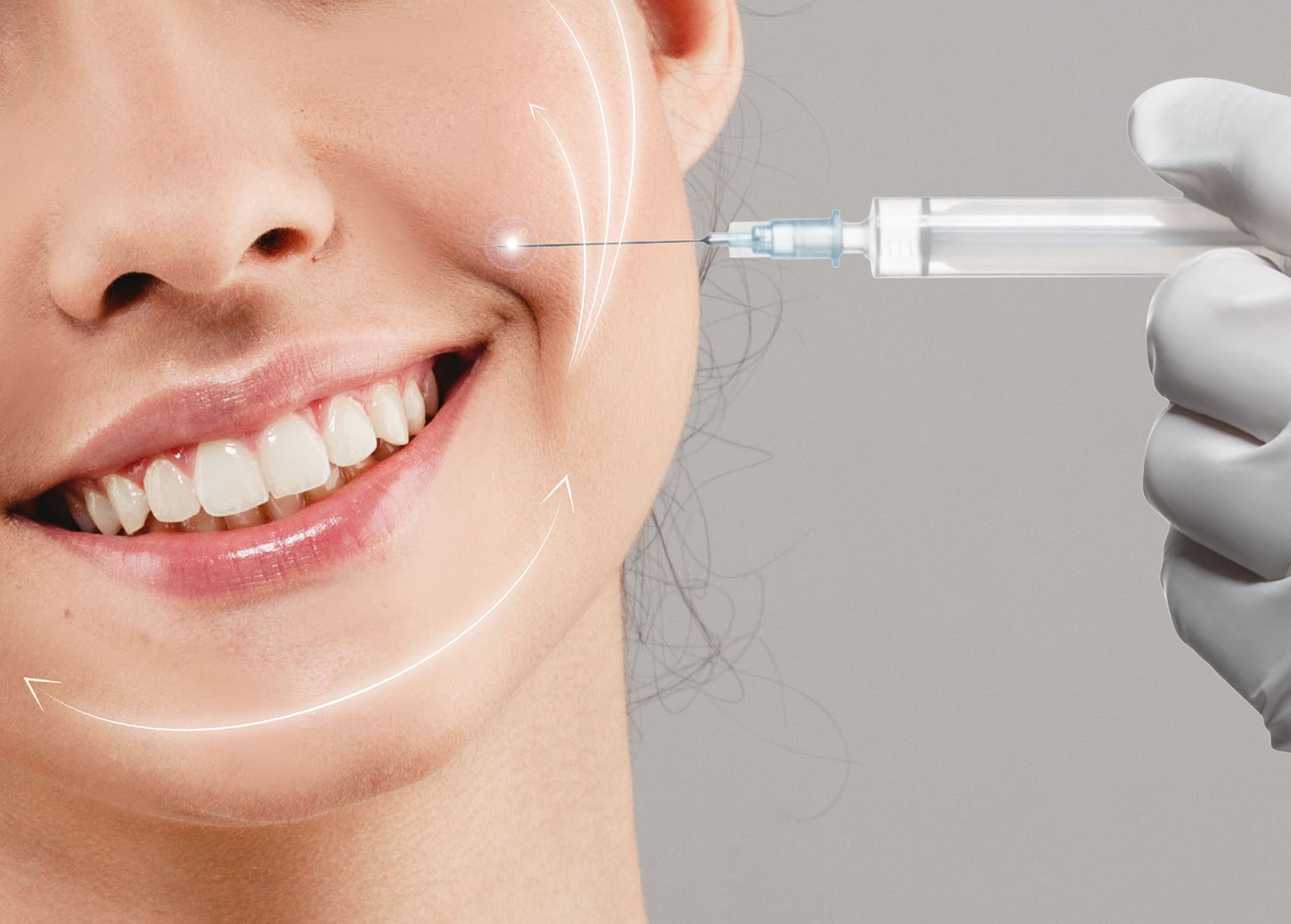 Dentist injecting filler into a smiling woman’s cheek with a syringe