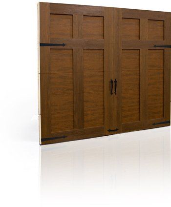 Wooden wall cabinet with paneled doors and black handles mounted on a white wall