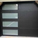 Black door or panel with four small frosted glass windows on the left side