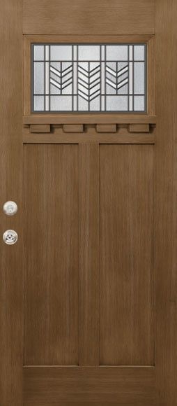 Brown wooden front door with small decorative window and silver knobs