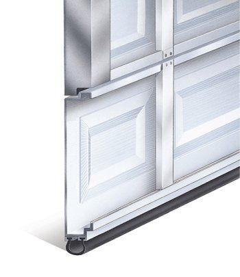 Close-up of a white sectional garage door track and bottom seal with metal frame