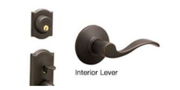 Interior lever door handle in dark bronze finish, shown with close-up detail.
