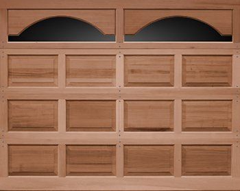 Wooden cabinet front with two arched glass doors on top and multiple rectangular paneled drawers below