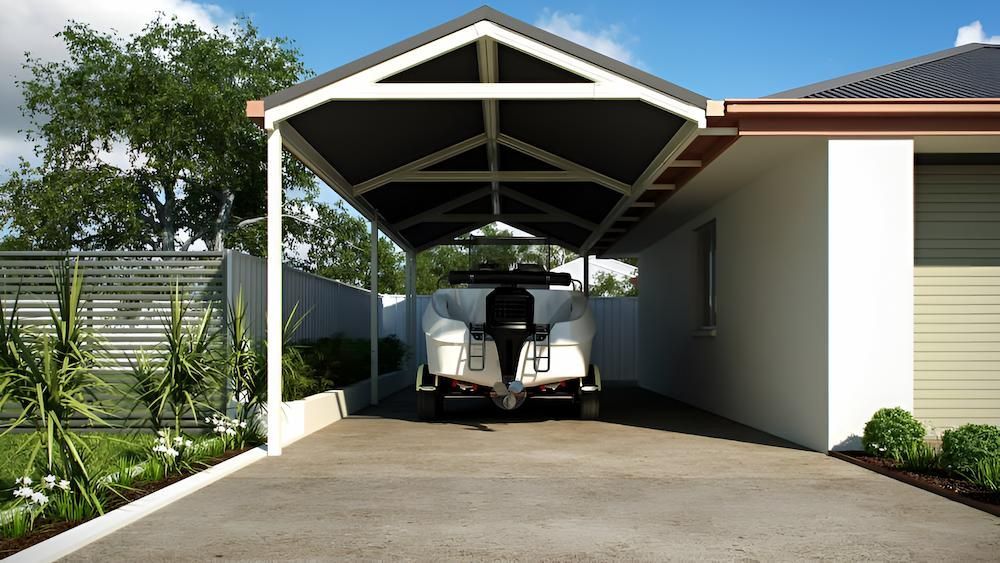 A Boat is Parked Under a Carport in Front of a House — Downright Carpentry in Ryan, QLD