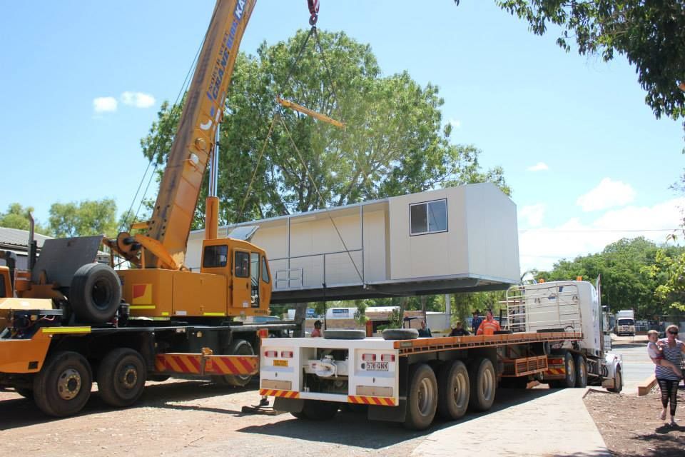A Truck With a Crane Attached to the Back of It — Downright Carpentry in Ryan, QLD
