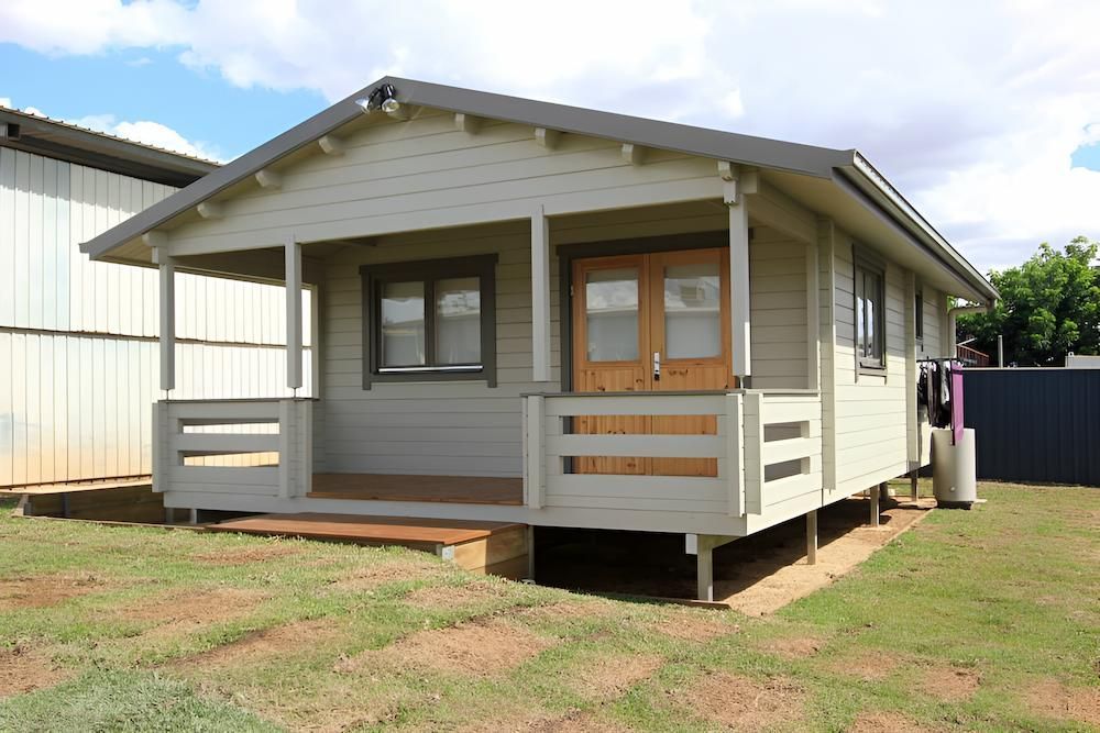 A Small White House With a Porch and a Fence — Downright Carpentry in Ryan, QLD