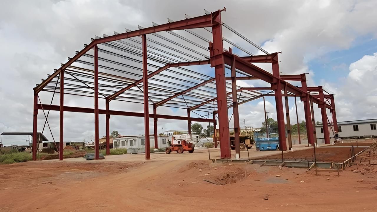 Large Metal Structure is Being Built in the Middle of a Dirt Field — Downright Carpentry in Ryan, QLD