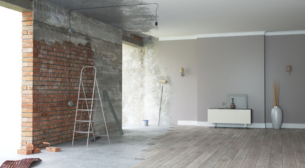 Before and After Picture of a Living Room Being Remodeled — Downright Carpentry in Ryan, QLD