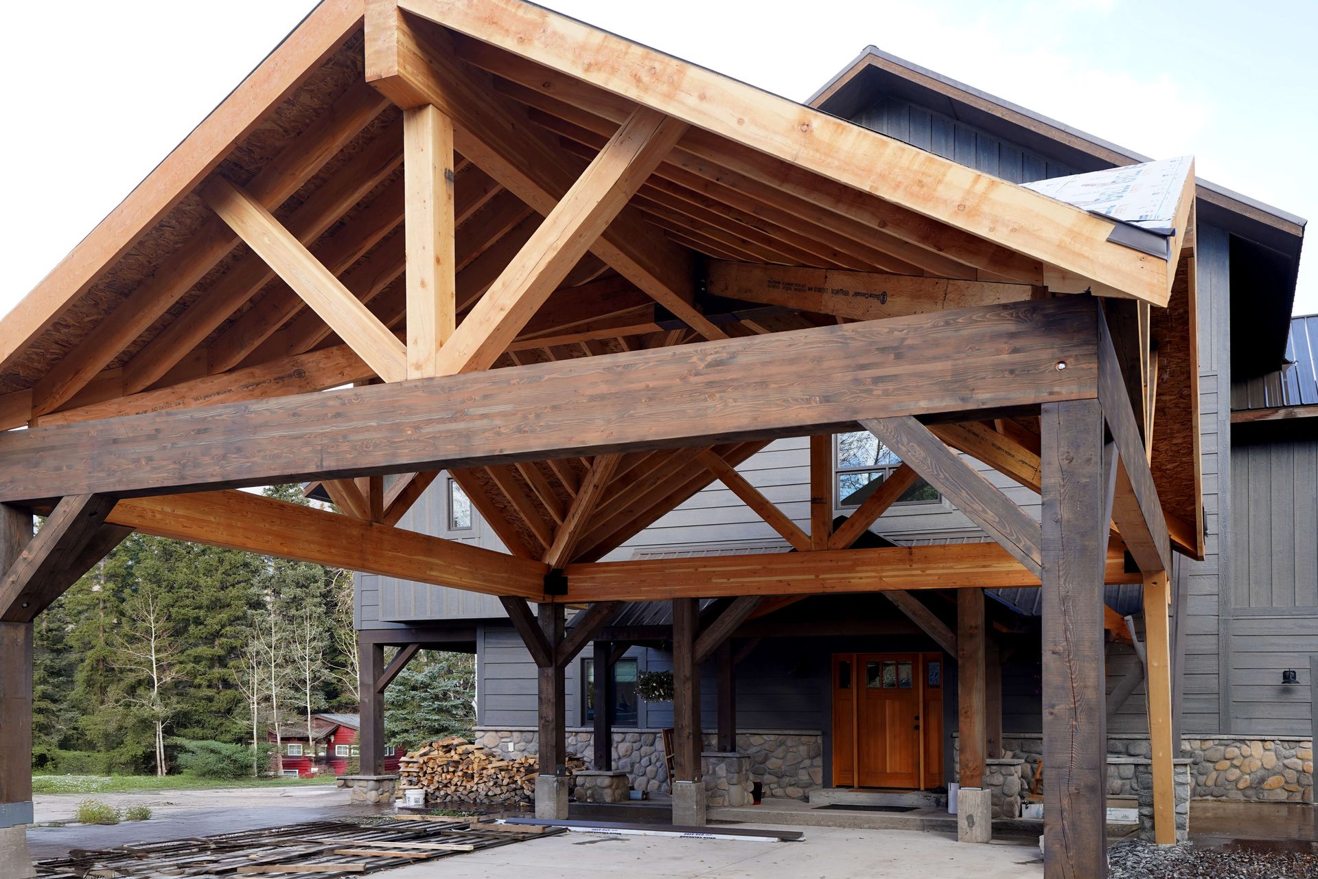 A house with a wooden roof and a wooden porch