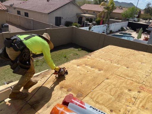 Man Installing Flat Roof — Phoenix, AZ — Halo Metal Roofing