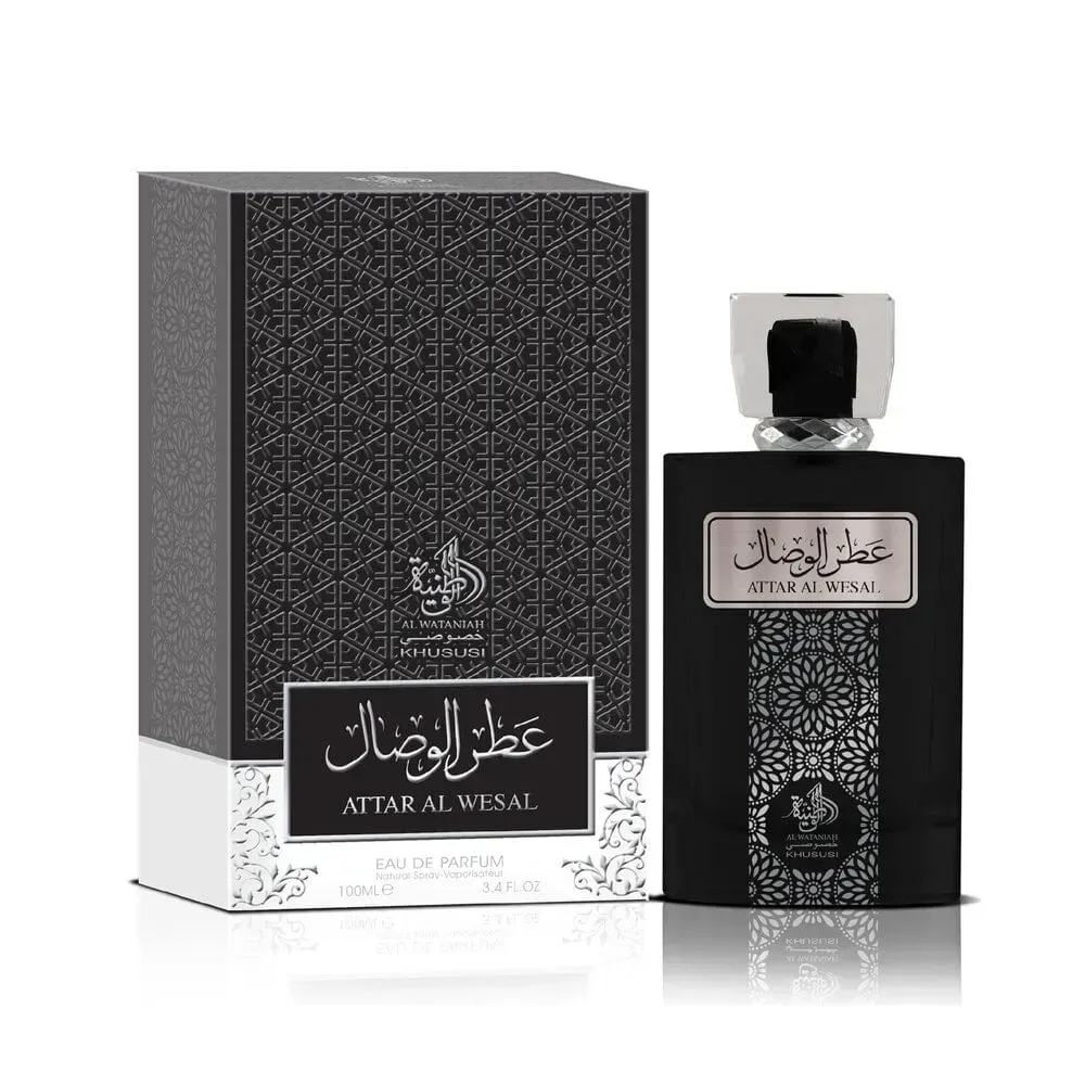 Frasco de perfume ATTAR AL WESAL negro con tapón plateado junto a una caja a juego sobre fondo blanco.