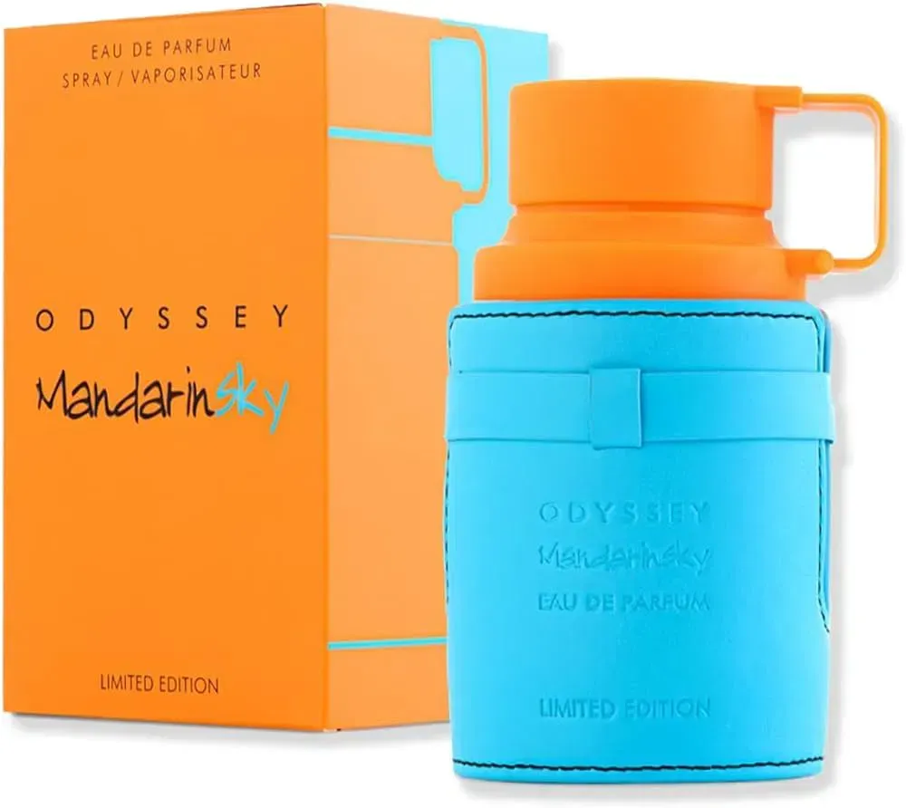 Frasco de perfume Odyssey Mandarin Sky en color naranja y turquesa con caja a juego.